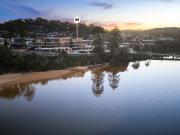 Sophisticated coastal living directly across from the sand
