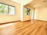 Spacious 2 bedroom unit with garage and balcony