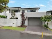 Spacious And Modern Four Bedroom Home in Private Enclave !