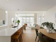 Spacious designer living with escarpment views