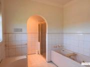 “Spacious Family Living with Dual Kitchens and Versatile...