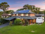 Spacious lakeside home on corner block with pool