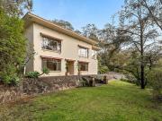 Elevated mid century family living on a rare 2,434sqm...