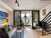 Split level penthouse with multiple balconies and city views