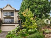 Stand tall in a foothills sanctuary where city views...