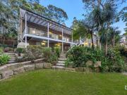 Storybook Charm Meets Architectural Finesse Amid Natural...