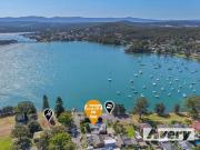 Stunning Lake Views Await at 73 Middle Point Road