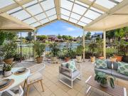 Stunning Lakeside Living within secure community
