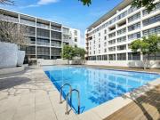 Stylish split level residence in resort style security...