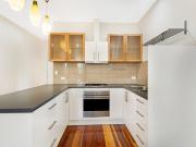 Stylish Top Floor Apartment with Loft Storage in the...
