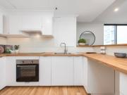 Sun Drenched Courtyard Haven with City Skyline Views