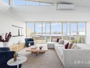 Sun soaked living with sweeping city sights