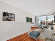 Sunlit Dual Level Apartment: Modern Living in a Prime...