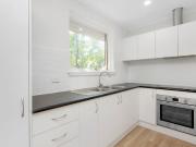 SUNLIT SANCTUARY IN THE HEART OF SANDY VILLAGE