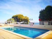 T2 na primeira linha de com garagem e piscina em Quarteira