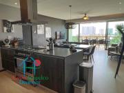 En condominio de playa. Terraza con vista a las albercas