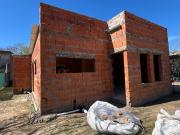 TERRENO CON CASA A TERMINAR