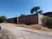 TERRENO PLANO CON BARDA PERIMETRAL