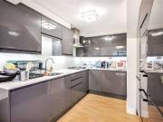 This recently renovated duplex three bedroom apartment...