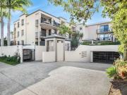 This well presented top floor apartment in sought after...