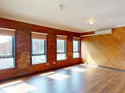 Top Floor Apartment with Private Patio in a Prime...