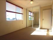 Top floor apartment with water glimpses
