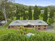 Tranquil and Substantial Residence on Acreage with Pool...