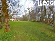 Un ancien moulin avec 7 chambres dont une partie du 18e...