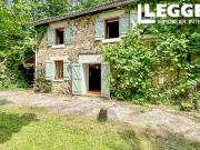 SOUS OFFRE Une fabuleuse grange rénovée offrant un...