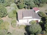 Une maison au fort potentiel dans un cadre verdoyant et...