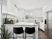 Updated coastal apartment blessed with convenience