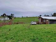 Vende Parcela con casa y Bodega en San Agustin camino...