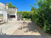 VENTA Casa 2 dormitorios más comodín, patio verde y...