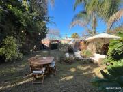 Venta Casa de tres dormitorios con jardín y cochera en...