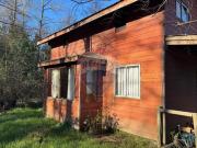 Venta de Terreno con 2 cabañas en Pucón
