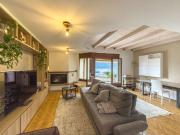 Zweibetthaus mit Seeblick und Garten in Bissone